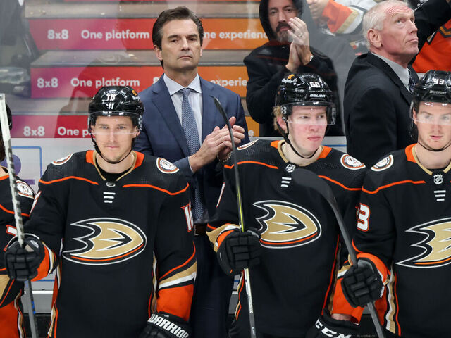 ANAHEIM, CA - APRIL 13: Dallas Eakins Head Coach of the Anaheim Ducks and coach Mike Stothers look on from the bench during the second period against the Los Angeles Kings at Honda Center on April 13, 2023 in Anaheim, California.
