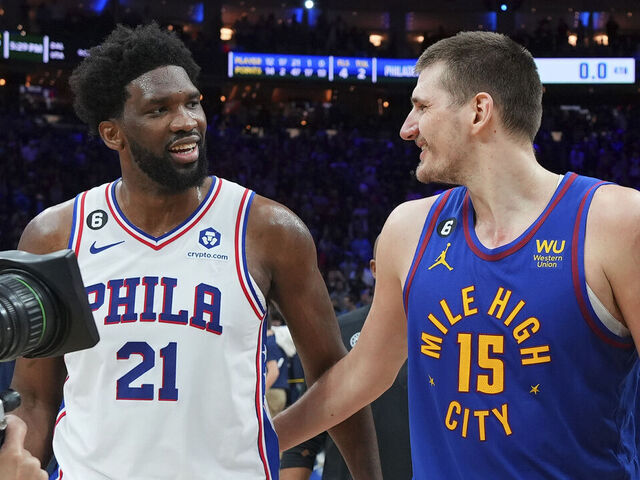 PHILADELPHIA, PA - JANUARY 28: Joel Embiid #21 of the Philadelphia 76ers and Nikola Jokic #15 of the Denver Nuggets embrace at the Wells Fargo Center on January 28, 2023 in Philadelphia, Pennsylvania.