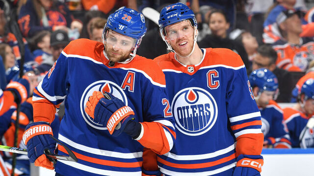 EDMONTON, CANADA - APRIL 01: Connor McDavid #97 and Leon Draisaitl #29 of the Edmonton Oilers have a conversation while awaiting a face-off during the game against the Anaheim Ducks on April 1, 2023 at Rogers Place in Edmonton, Alberta, Canada.