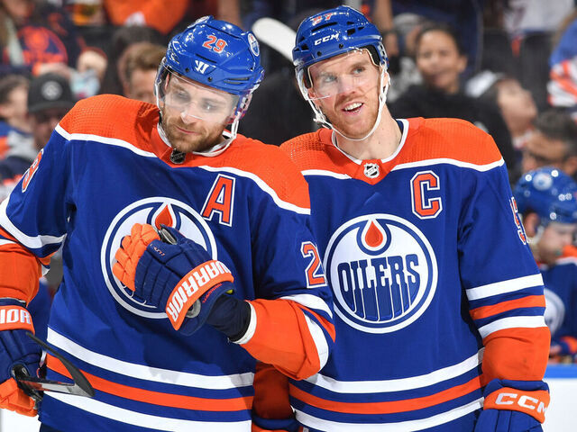 EDMONTON, CANADA - APRIL 01: Connor McDavid #97 and Leon Draisaitl #29 of the Edmonton Oilers have a conversation while awaiting a face-off during the game against the Anaheim Ducks on April 1, 2023 at Rogers Place in Edmonton, Alberta, Canada.