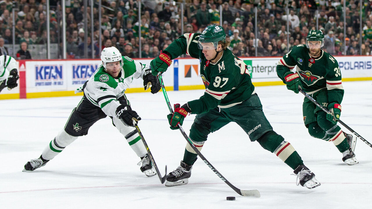 SAINT PAUL, MN - FEBRUARY 17: Minnesota Wild left wing Kirill Kaprizov (97) shoots the puck while being defended by Dallas Stars defenseman Miro Heiskanen (4) during the NHL game between the Dallas Stars and the Minnesota Wild, on February 17th, 2023, at the Xcel Energy Center in Saint Paul, MN.