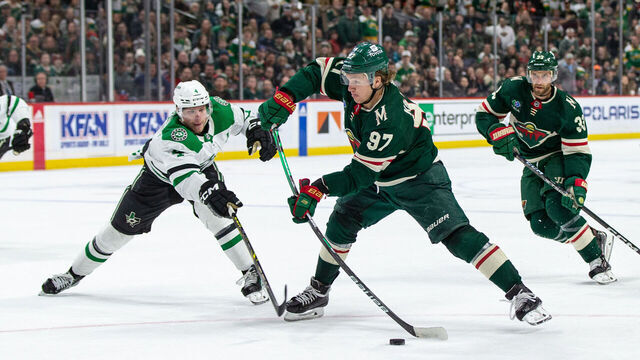 SAINT PAUL, MN - FEBRUARY 17: Minnesota Wild left wing Kirill Kaprizov (97) shoots the puck while being defended by Dallas Stars defenseman Miro Heiskanen (4) during the NHL game between the Dallas Stars and the Minnesota Wild, on February 17th, 2023, at the Xcel Energy Center in Saint Paul, MN.