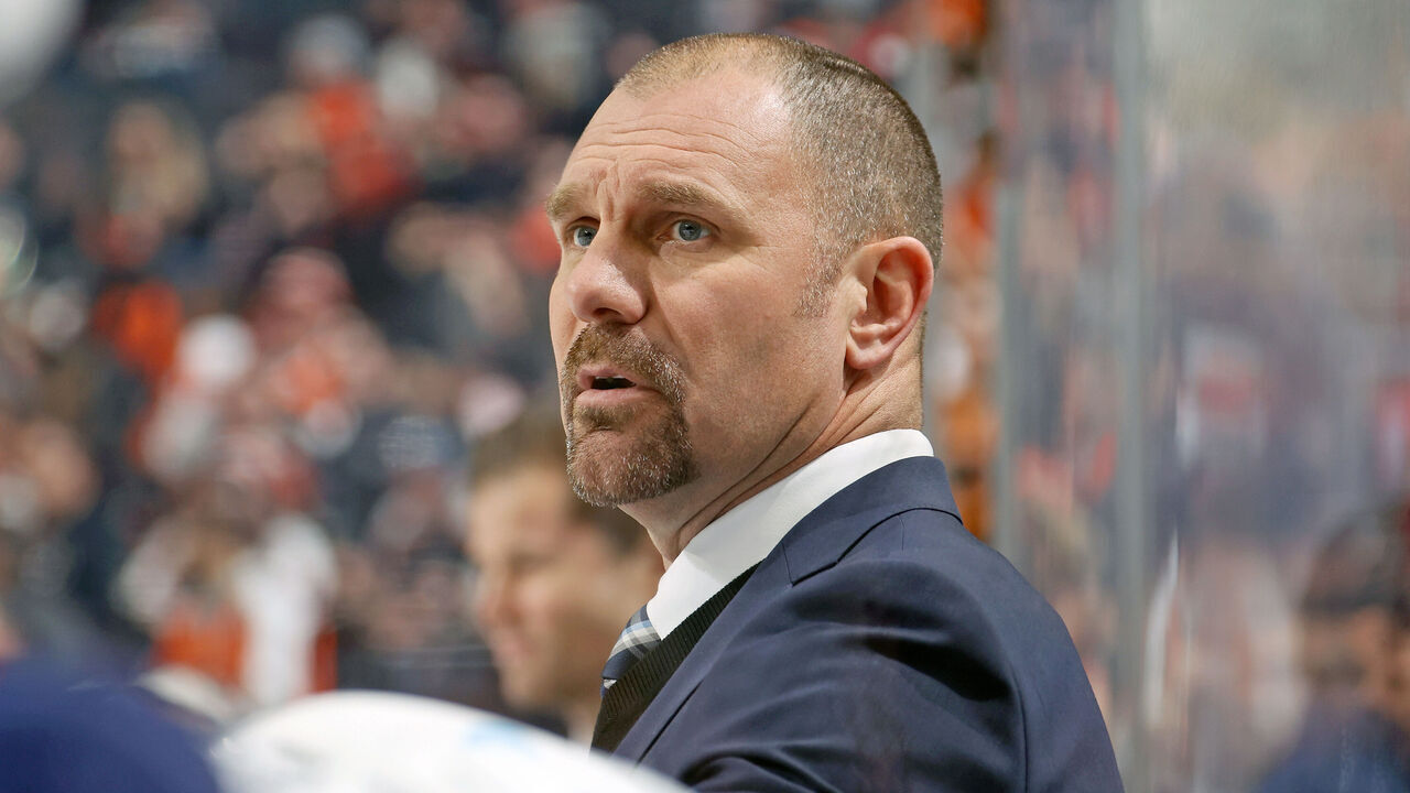 PHILADELPHIA, PENNSYLVANIA - DECEMBER 20: Head Coach of the Columbus Blue Jackets Brad Larsen watches the play on the ice during the first period against the Philadelphia Flyers at the Wells Fargo Center on December 20, 2022 in Philadelphia, Pennsylvania.