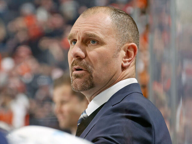PHILADELPHIA, PENNSYLVANIA - DECEMBER 20: Head Coach of the Columbus Blue Jackets Brad Larsen watches the play on the ice during the first period against the Philadelphia Flyers at the Wells Fargo Center on December 20, 2022 in Philadelphia, Pennsylvania.