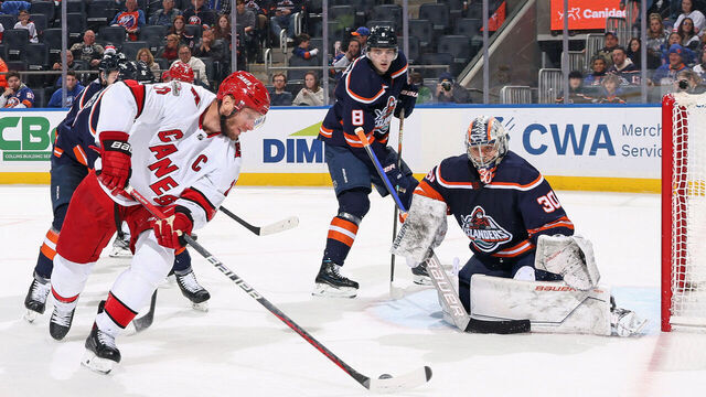 ELMONT, NEW YORK - JANUARY 21: Ilya Sorokin #30 of the New York Islanders defends against Jordan Staal #11 of the Carolina Hurricanes during the third period at UBS Arena on January 21, 2023 in Elmont, New York. The Hurricanes defeated the Islanders 5-2.