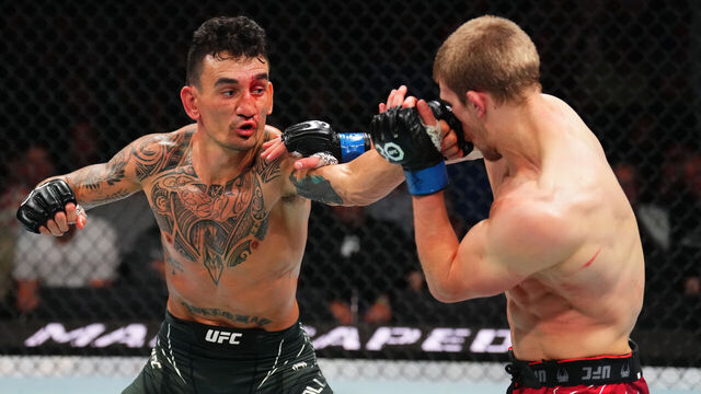 KANSAS CITY, MISSOURI - APRIL 15: (L-R) Max Holloway punches Arnold Allen of England in a featherweight fight during the UFC Fight Night event at T-Mobile Center on April 15, 2023 in Kansas City, Missouri.