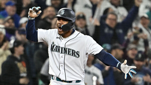 SEATTLE, WASHINGTON - APRIL 15: Julio Rodriguez #42 of the Seattle Mariners celebrates after hitting a triple during the fourth inning of the game against the Colorado Rockies at T-Mobile Park on April 15, 2023 in Seattle, Washington. All players are wearing the number 42 in honor of Jackie Robinson Day.