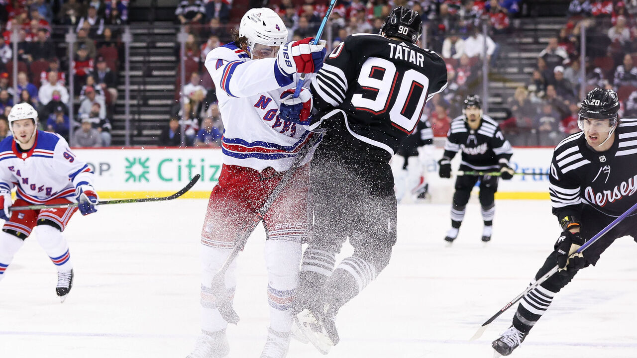 NEWARK, NJ - MARCH 30: New York Rangers defenseman Braden Schneider (4) and New Jersey Devils left wing Tomas Tatar (90) hit each other during the National Hockey League game between the New York Rangers and the New Jersey Devils on March 30, 2023 at Prudential Center in Newark, NJ.