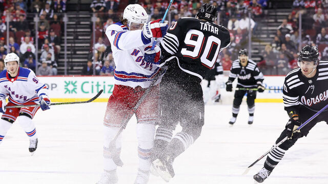 NEWARK, NJ - MARCH 30: New York Rangers defenseman Braden Schneider (4) and New Jersey Devils left wing Tomas Tatar (90) hit each other during the National Hockey League game between the New York Rangers and the New Jersey Devils on March 30, 2023 at Prudential Center in Newark, NJ.