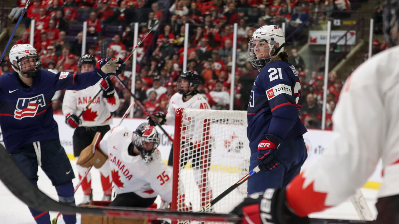 BRAMPTON, ONTARIO - APRIL 16: Forward Hilary Knight #21 of USA scores her second period goal against goaltender Ann-Renee Desbiens #35 of Canada during the gold medal game of the 2023 IIHF Women's World Championship at CAA Centre on April 16, 2023 in Brampton, Ontario.