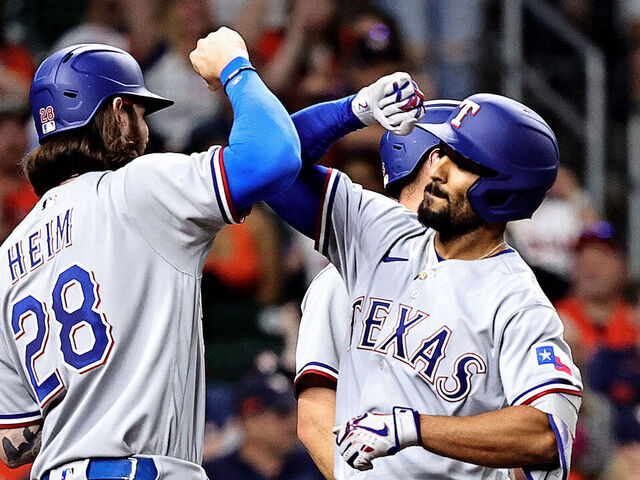 Texas Rangers' Marcus Semien takes batting practice before a