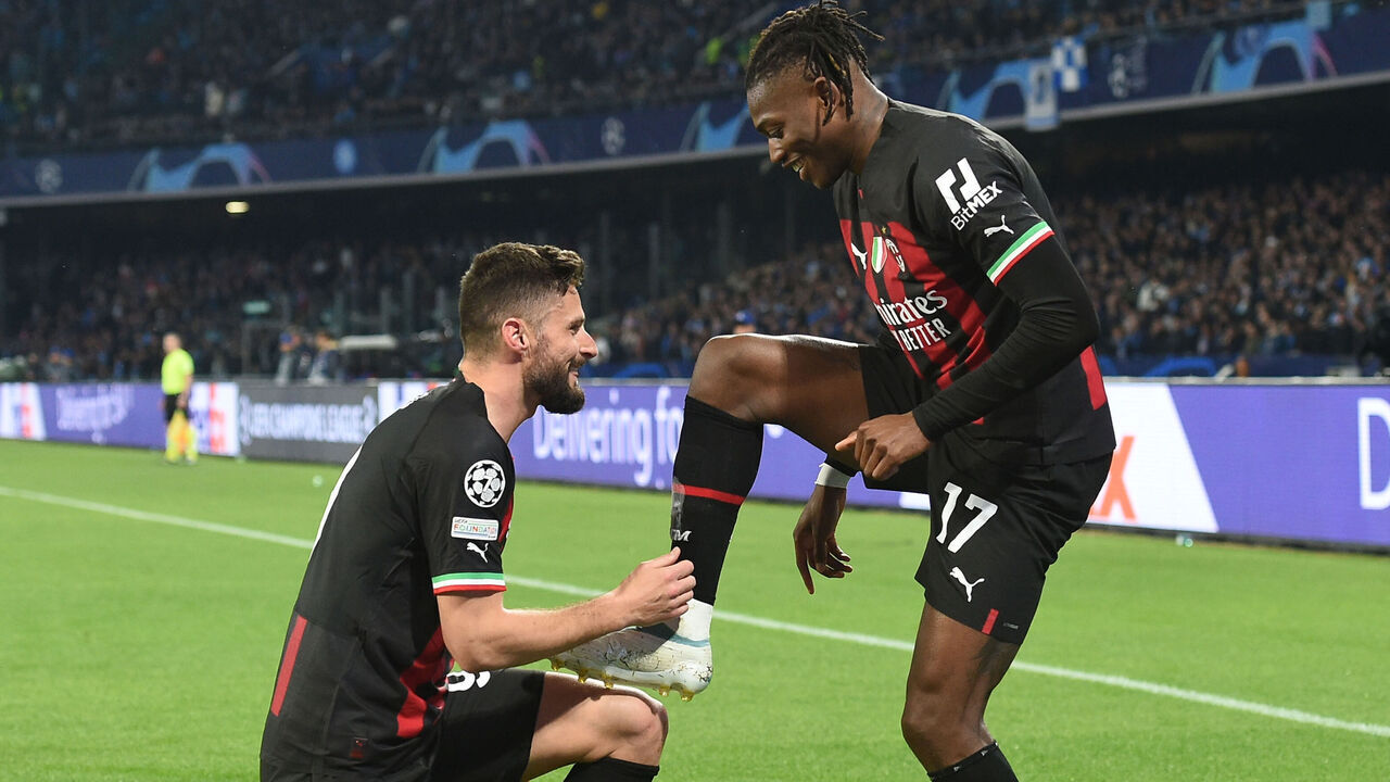 Rafael Leao and Olivier Giroud of AC Milan celebrates with team mates after 1-0 during the UEFA Champions League match between SSC Napoli and AC Milan at Stadio Diego Armando Maradona Naples Italy on 18 April 2023.