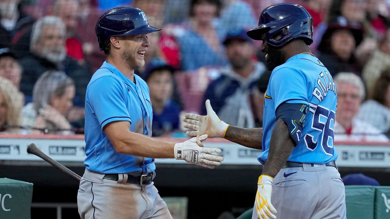 CINCINNATI, OHIO - APRIL 18: Taylor Walls #6 and Randy Arozarena #56 of the Tampa Bay Rays celebrate after Arozarena hit a home run in the fourth inning against the Cincinnati Reds at Great American Ball Park on April 18, 2023 in Cincinnati, Ohio.