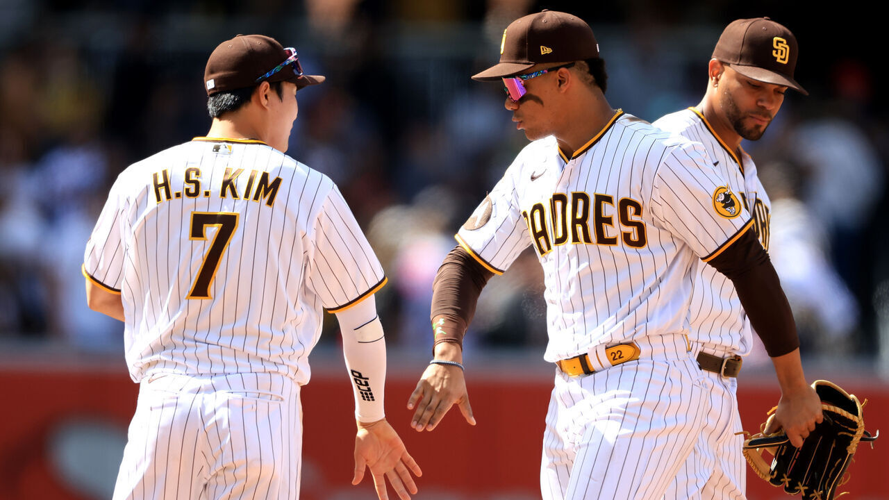SAN DIEGO, CALIFORNIA - APRIL 19: Juan Soto #22 and Ha-Seong Kim #7 of the San Diego Padres celebrate after defeating the Atlanta Braves 1-0 in a game at PETCO Park on April 19, 2023 in San Diego, California.