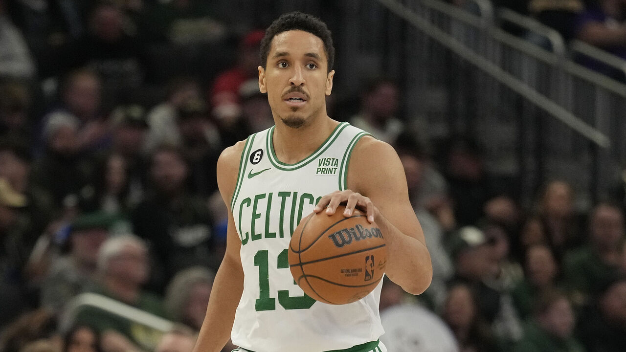 MILWAUKEE, WISCONSIN - MARCH 30: Malcolm Brogdon #13 of the Boston Celtics dribbles the ball against the Milwaukee Bucks in the second half at Fiserv Forum on March 30, 2023 in Milwaukee, Wisconsin.