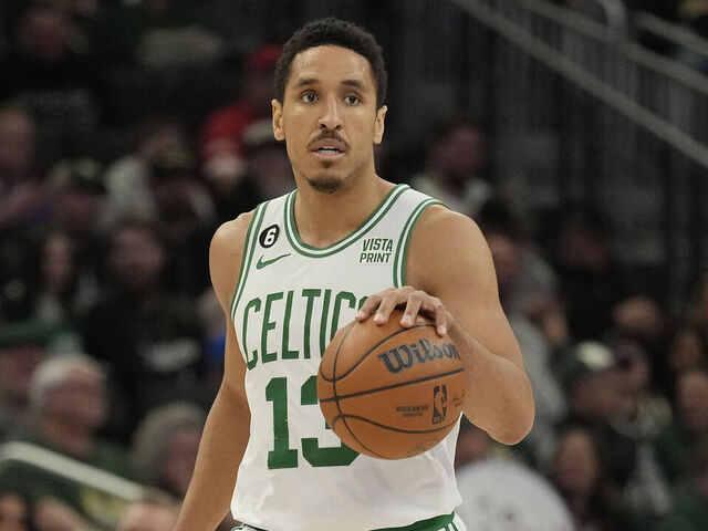 MILWAUKEE, WISCONSIN - MARCH 30: Malcolm Brogdon #13 of the Boston Celtics dribbles the ball against the Milwaukee Bucks in the second half at Fiserv Forum on March 30, 2023 in Milwaukee, Wisconsin.