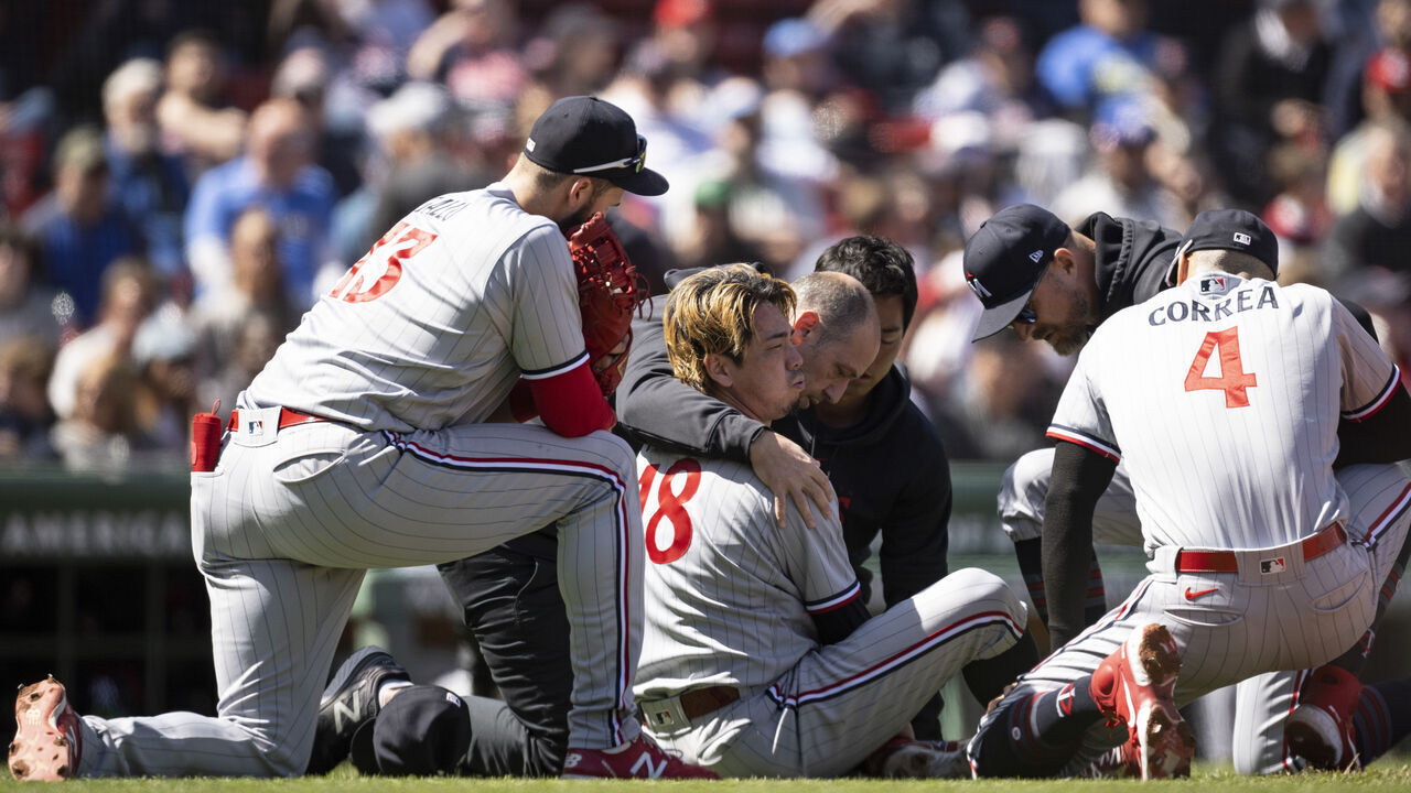 BOSTON, MA - APRIL 20: Kenta Maeda #18 of the Minnesota Twins reacts after being hitting hit in the leg with a comebacker during the second inning of a game against the Boston Red Sox on April 20, 2023 at Fenway Park in Boston, Massachusetts.