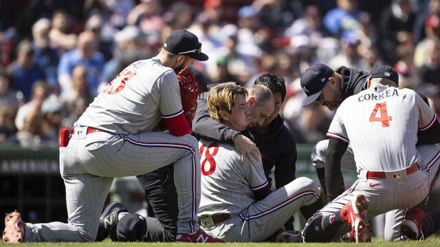 BOSTON, MA - APRIL 20: Kenta Maeda #18 of the Minnesota Twins reacts after being hitting hit in the leg with a comebacker during the second inning of a game against the Boston Red Sox on April 20, 2023 at Fenway Park in Boston, Massachusetts.
