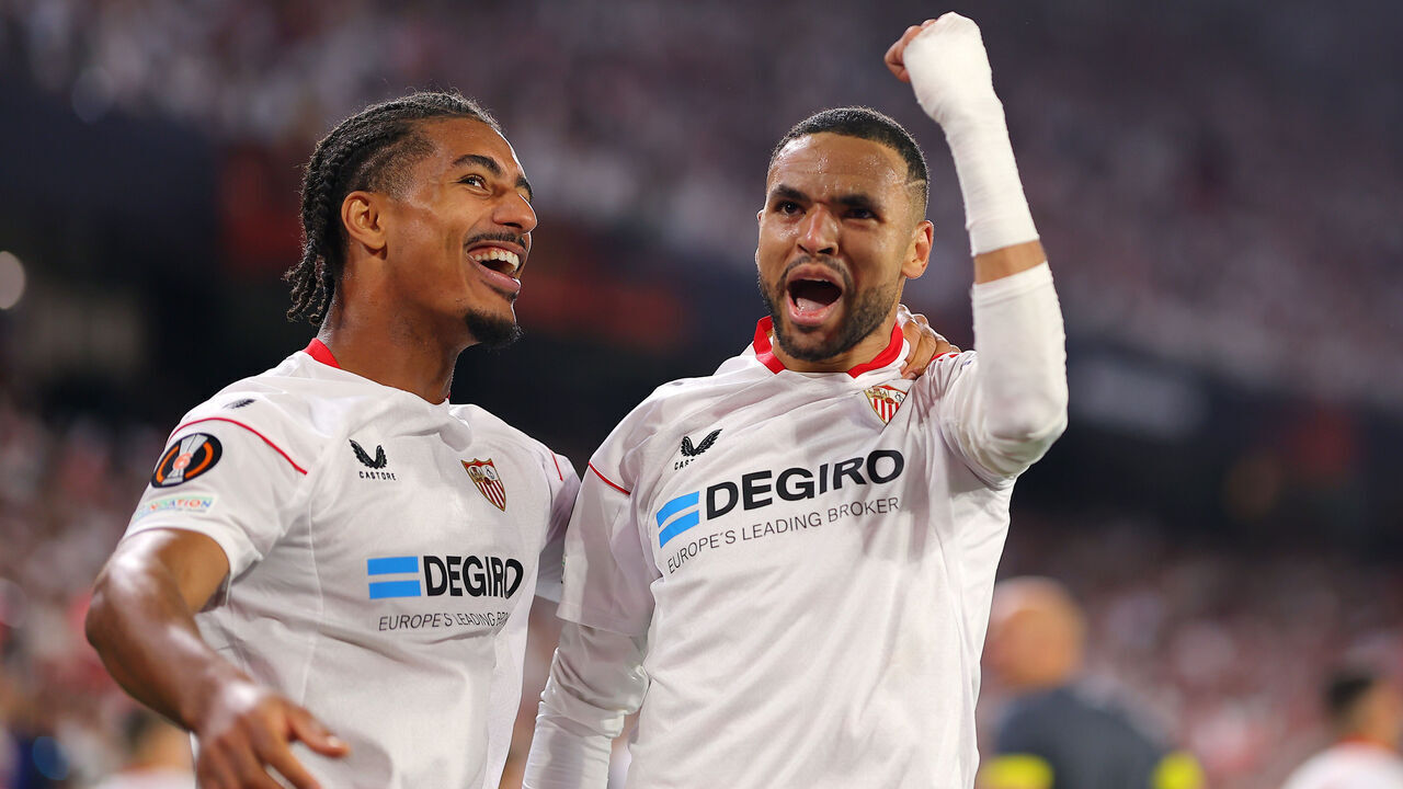 SEVILLE, SPAIN - APRIL 20: Yousseff En-Nesyri of Sevilla FC celebrates after scoring the team's third goal with teammate Loic Bade during the UEFA Europa League Quarterfinal Second Leg match between Sevilla FC and Manchester United at Estadio Ramon Sanchez Pizjuan on April 20, 2023 in Seville, Spain.