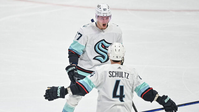 DENVER, COLORADO - APRIL 18: Morgan Geekie #67 of the Seattle Kraken celebrates with Justin Schultz #4 after scoring a goal against the Colorado Avalanche in the third period of Game One in the First Round of the 2023 Stanley Cup Playoffs at Ball Arena on April 18, 2023 in Denver, Colorado.