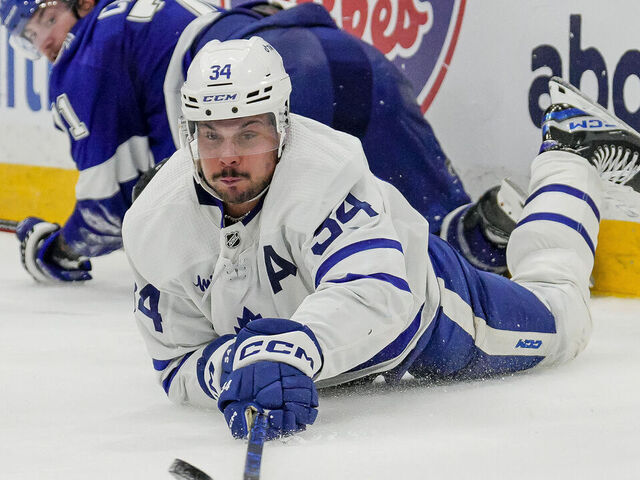 TAMPA, FL - APRIL 22: Toronto Maple Leafs center Auston Matthews (34) dives to make a pass from behind the net during the NHL first round 2023 playoffs game 3 Hockey match between the Tampa Bay Lightning and Toronto Maple Leafs on April 22nd 2023 at Amalie Arena in Tampa, FL.