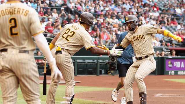 PHOENIX, ARIZONA - APRIL 22: Fernando Tatis Jr. #23 of the San Diego Padres celebrates with Juan Soto #22 after hitting a solo home run against the Arizona Diamondbacks during the first inning of the MLB game at Chase Field on April 22, 2023 in Phoenix, Arizona.