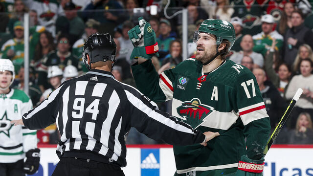 ST PAUL, MN - APRIL 21: Marcus Foligno #17 of the Minnesota Wild is separated by linesman Bryan Pancich #94 after a play in the third period of Game Three of the First Round of the 2023 Stanley Cup Playoffs against the Dallas Stars at Xcel Energy Center on April 21, 2023 in St Paul, Minnesota.