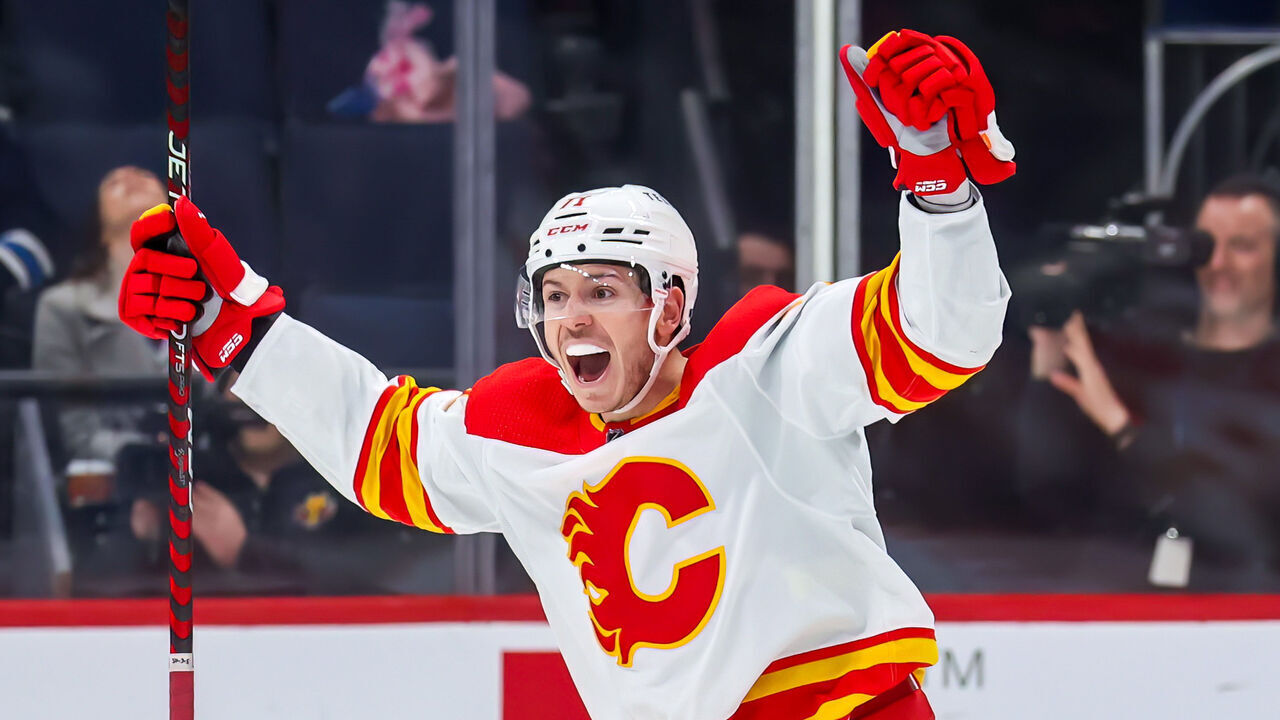 WINNIPEG, CANADA - APRIL 05: Walker Duehr #71 of the Calgary Flames celebrates his third period goal against the Winnipeg Jets at Canada Life Centre on April 05, 2023 in Winnipeg, Manitoba, Canada.