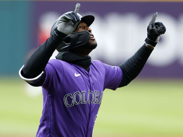 Mike Moustakas of the Colorado Rockies celebrates as he looks at News  Photo - Getty Images