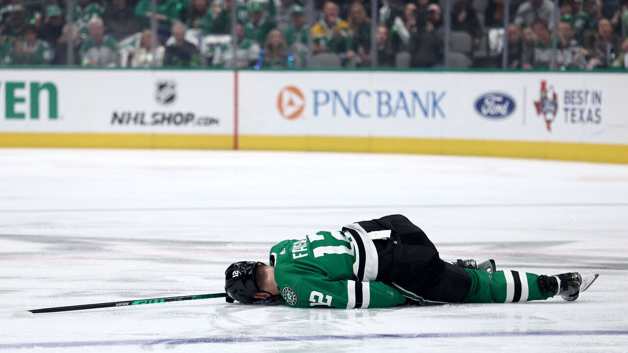 DALLAS, TEXAS - APRIL 25: Radek Faksa #12 of the Dallas Stars lays on the ice after being checked by Marcus Foligno #17 of the Minnesota Wild in the first period in Game Five of the First Round of the 2023 Stanley Cup Playoffs at American Airlines Center on April 25, 2023 in Dallas, Texas.