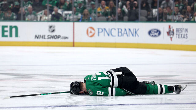 DALLAS, TEXAS - APRIL 25: Radek Faksa #12 of the Dallas Stars lays on the ice after being checked by Marcus Foligno #17 of the Minnesota Wild in the first period in Game Five of the First Round of the 2023 Stanley Cup Playoffs at American Airlines Center on April 25, 2023 in Dallas, Texas.