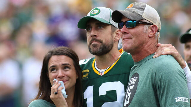 GREEN BAY, WI - SEPTEMBER 15: Green Bay Packers quarterback Aaron Rodgers (12) watches a tribute to Bart Starr with Leann Nelson and Brett Favre during a game between the Green Bay Packers and the Minnesota Vikings on September 15, 2019 at Lambeau Field in Green Bay, WI.
