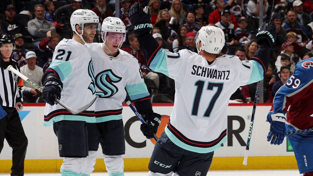 DENVER, COLORADO - APRIL 26: Alex Wennberg #21, Morgan Geekie #67 and Jaden Schwartz #17 of the Seattle Kraken celebrate a goal against the Colorado Avalanche in Game Five of the First Round of the 2023 Stanley Cup Playoffs at Ball Arena on April 26, 2023 in Denver, Colorado.