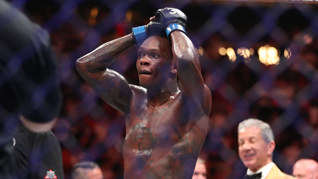 MIAMI, FLORIDA - APRIL 8: Israel Adesanya celebrates his victory over Alex Pereira in their middleweight fight during the UFC 287 event on April 8, 2023, at the Kaseya Center in Miami, FL.