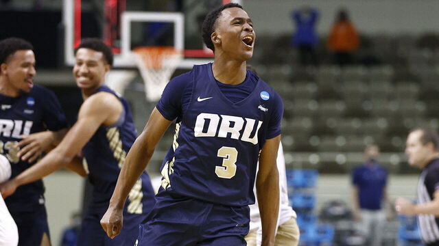 INDIANAPOLIS, INDIANA - MARCH 21: Max Abmas #3 of the Oral Roberts Golden Eagles celebrates with teammates after defeating the Florida Gators in the second round game of the 2021 NCAA Men's Basketball Tournament at Indiana Farmers Coliseum on March 21, 2021 in Indianapolis, Indiana. Oral Roberts defeated Florida 81-78.
