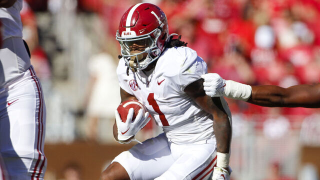 FAYETTEVILLE, AR - OCTOBER 01: Alabama Crimson Tide running back Jahmyr Gibbs (1) carries the football during the college football game between the Alabama Crimson Tide and Arkansas Razorbacks on October 1, 2022, at Donald W. Reynolds Razorback Stadium in Fayetteville, Arkansas.