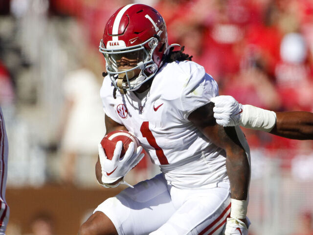 FAYETTEVILLE, AR - OCTOBER 01: Alabama Crimson Tide running back Jahmyr Gibbs (1) carries the football during the college football game between the Alabama Crimson Tide and Arkansas Razorbacks on October 1, 2022, at Donald W. Reynolds Razorback Stadium in Fayetteville, Arkansas.