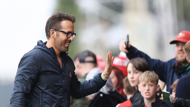 WREXHAM, WALES - APRIL 22: Wrexham co-owner Ryan Reynolds greets fans before the Vanarama National League match between Wrexham and Boreham Wood at Racecourse Ground on April 22, 2023 in Wrexham, Wales.