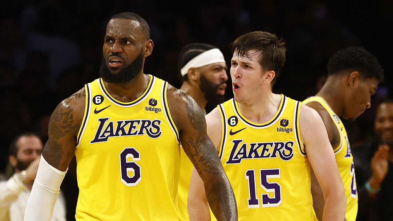 LOS ANGELES, CALIFORNIA - APRIL 24: LeBron James #6 and Austin Reaves #15 of the Los Angeles Lakers react against the Memphis Grizzlies in overtime of Game Four of the Western Conference First Round Playoffs at Crypto.com Arena on April 24, 2023 in Los Angeles, California. NOTE TO USER: User expressly acknowledges and agrees that, by downloading and/or using this photograph, user is consenting to the terms and conditions of the Getty Images License Agreement.