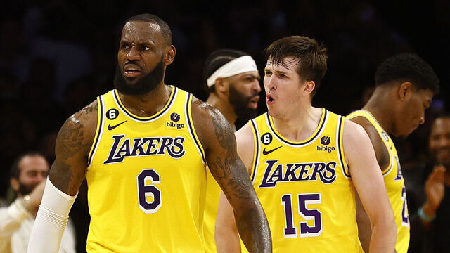 LOS ANGELES, CALIFORNIA - APRIL 24: LeBron James #6 and Austin Reaves #15 of the Los Angeles Lakers react against the Memphis Grizzlies in overtime of Game Four of the Western Conference First Round Playoffs at Crypto.com Arena on April 24, 2023 in Los Angeles, California. NOTE TO USER: User expressly acknowledges and agrees that, by downloading and/or using this photograph, user is consenting to the terms and conditions of the Getty Images License Agreement.