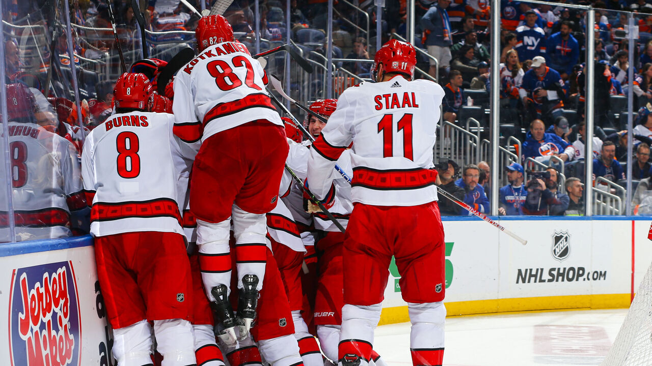 ELMONT, NEW YORK - APRIL 28: Paul Stastny #26 of the Carolina Hurricanes celebrates with teammates after scoring the game winning goal in overtime against the New York Islanders in Game Six of the First Round of the 2023 Stanley Cup Playoffs at UBS Arena on April 28, 2023 in Elmont, New York.