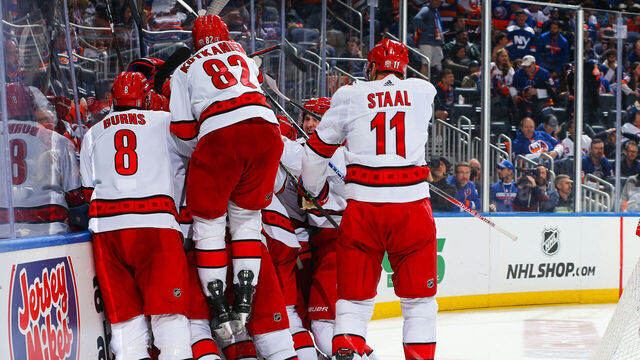 ELMONT, NEW YORK - APRIL 28: Paul Stastny #26 of the Carolina Hurricanes celebrates with teammates after scoring the game winning goal in overtime against the New York Islanders in Game Six of the First Round of the 2023 Stanley Cup Playoffs at UBS Arena on April 28, 2023 in Elmont, New York.