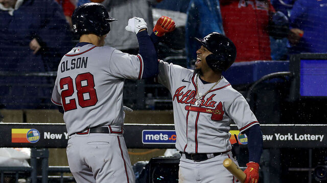 NEW YORK, NEW YORK - APRIL 28: Ozzie Albies #1 of the Atlanta Braves congratulates teammate Matt Olson #28 after Olson hit a three run home run in the fifth inning against the New York Mets at Citi Field on April 28, 2023 in the Flushing neighborhood of the Queens borough of New York City.