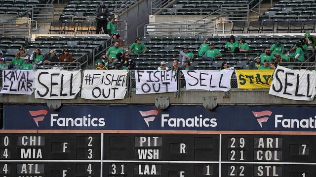 OAKLAND, CALIFORNIA - APRIL 28: With the decision to move from Oakland to Las Vegas fans of the Oakland Athletics hang signs from the right field seats during the game against the Cincinnati Reds at RingCentral Coliseum on April 28, 2023 in Oakland, California.