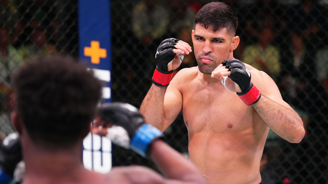 LAS VEGAS, NEVADA - AUGUST 06: (R-L) Vicente Luque battles Geoff Neal in a welterweight fight during the UFC Fight Night event at UFC APEX on August 06, 2022 in Las Vegas, Nevada.