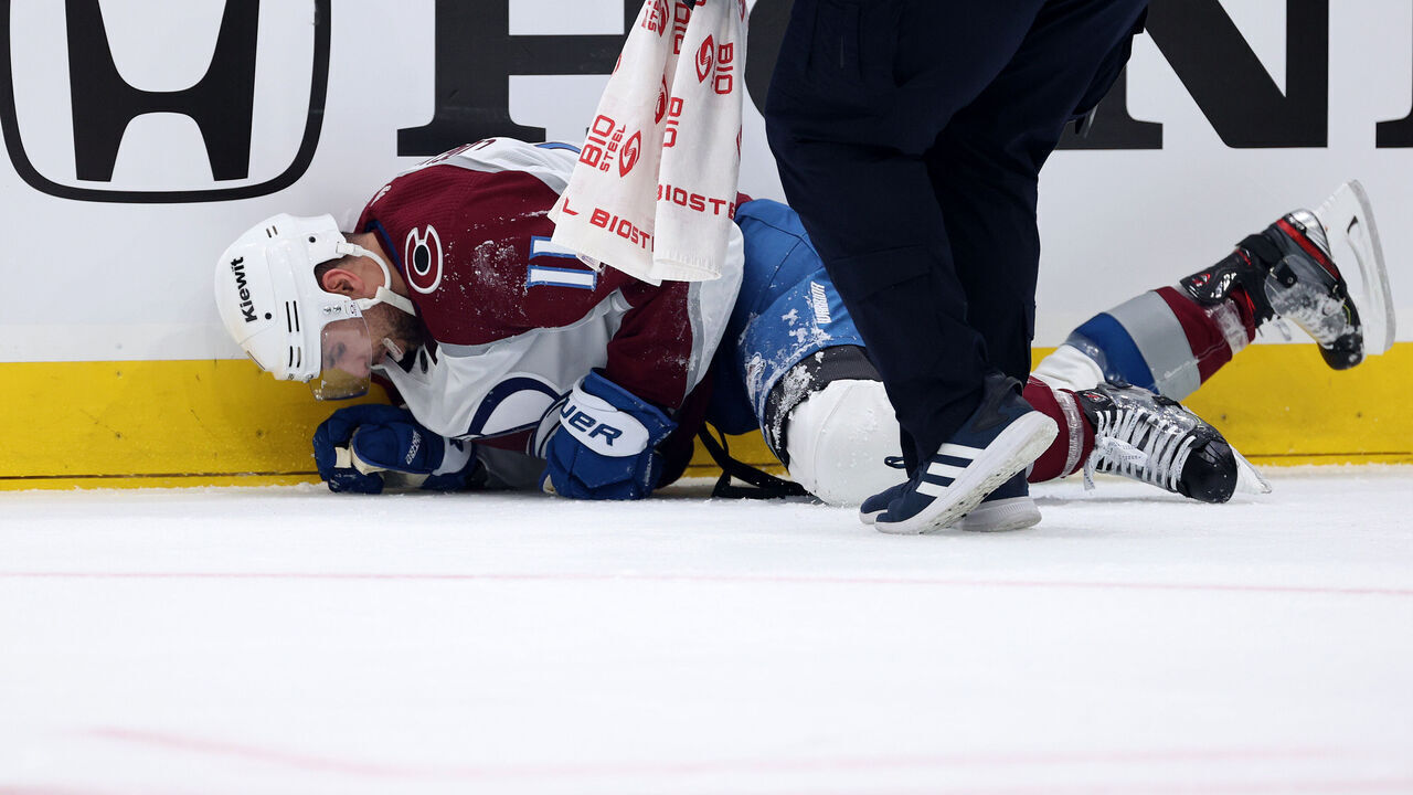 SEATTLE, WASHINGTON - APRIL 28: Andrew Cogliano #11 of the Colorado Avalanche is tended to by medical staff against the Seattle Kraken during the second period in Game Six of the First Round of the 2023 Stanley Cup Playoffs at Climate Pledge Arena on April 28, 2023 in Seattle, Washington.
