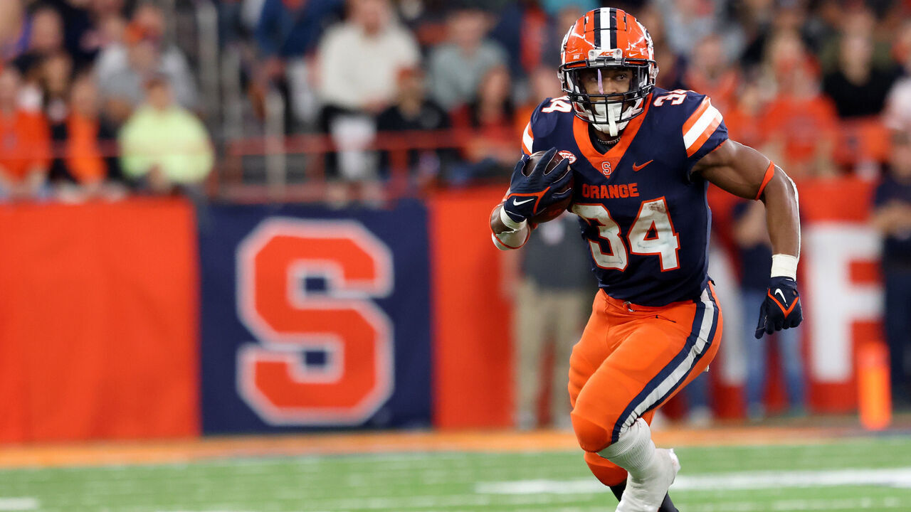 SYRACUSE, NEW YORK - OCTOBER 15: Sean Tucker #34 of the Syracuse Orange runs the ball during the third quarter against the North Carolina State Wolfpack at JMA Wireless Dome on October 15, 2022 in Syracuse, New York.