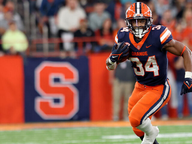 SYRACUSE, NEW YORK - OCTOBER 15: Sean Tucker #34 of the Syracuse Orange runs the ball during the third quarter against the North Carolina State Wolfpack at JMA Wireless Dome on October 15, 2022 in Syracuse, New York.
