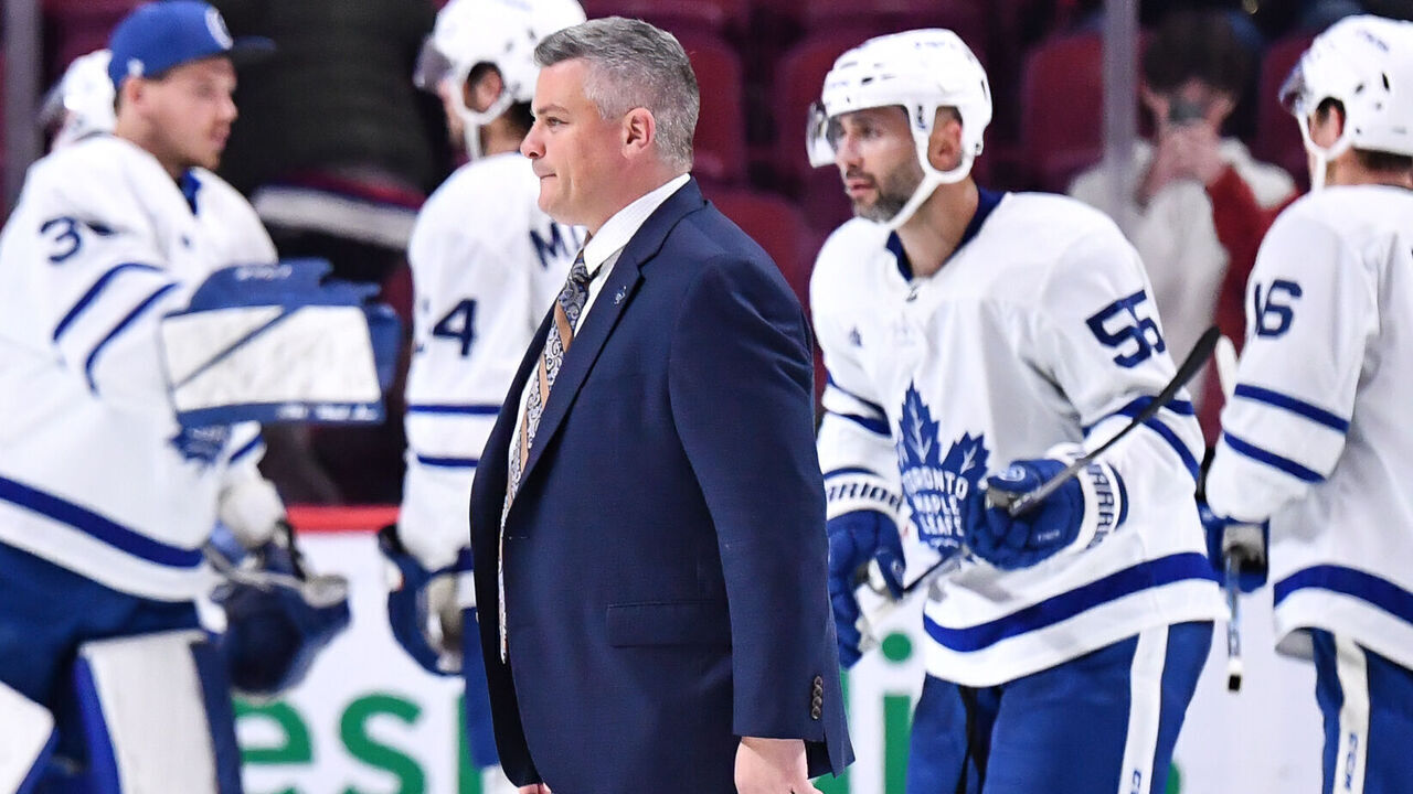 MONTREAL, CANADA - OCTOBER 03: Head coach of the Toronto Maple Leafs, Sheldon Keefe, walks across the ice after a victory against the Montreal Canadiens in a preseason game at Centre Bell on October 3, 2022 in Montreal, Quebec, Canada. The Toronto Maple Leafs defeated the Montreal Canadiens 5-1.