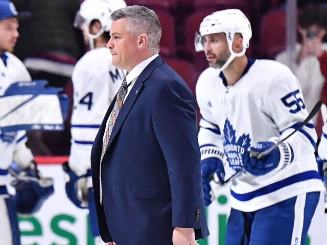 MONTREAL, CANADA - OCTOBER 03: Head coach of the Toronto Maple Leafs, Sheldon Keefe, walks across the ice after a victory against the Montreal Canadiens in a preseason game at Centre Bell on October 3, 2022 in Montreal, Quebec, Canada. The Toronto Maple Leafs defeated the Montreal Canadiens 5-1.